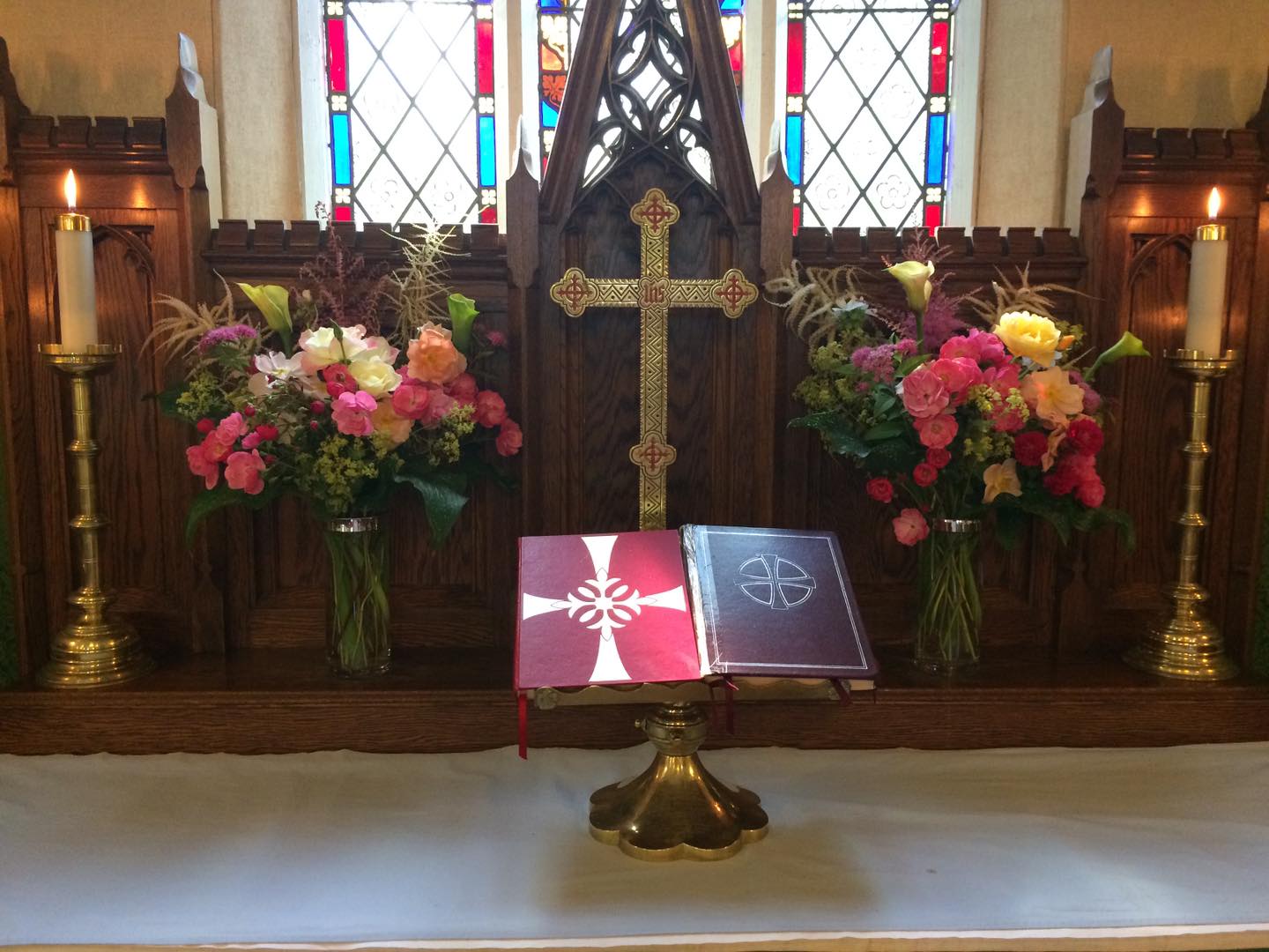 July 14th altar flowers are a combination of different coloured roses; mostly peach and pink shrub roses but also a few hybrid teas. Also included in the bouquets are calla lilies, pink spirea, pink and white astilbe, lady's mantle and calla lily leaves.